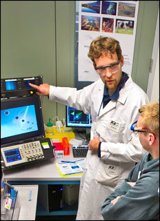 Study lead author Chris Rinke showing off the DOE JGI’ s single-cell genomics capabilities. Photo by Roy Kaltschmidt, Berkeley Lab.