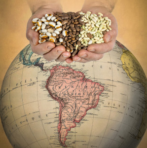 handful of beans over South America on a globe