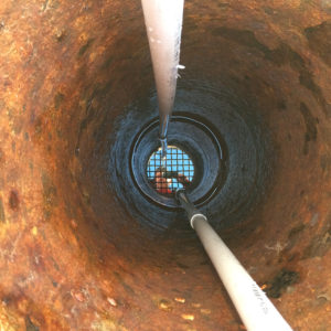 Looking down the geyser wellhead (which was an oil well whose drilling was abandoned when it started geysering in 1937) during a quiet period between minor eruptions. (Cathy Ryan)