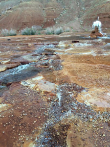 Crystal Geyer during its "major eruption" period, where sufficient discharge is produced to cause overland flow to the Green River. (Cathy Ryan)