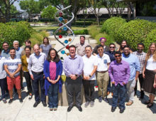 Directly in front of the helix, JGI Director Nigel Mouncey and JGI-UC Merced Genomics Internship founders organizers Axel Visel, Suzanne Sindi and Zhong Wang are flanked by UC Merced student alumni and their JGI mentors.