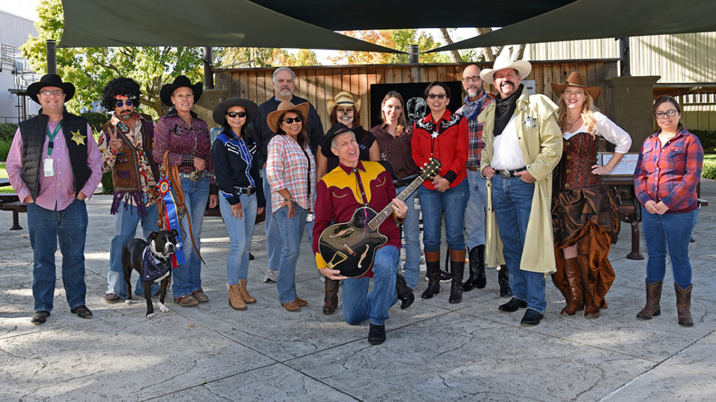 Ray (in coat) with JGI Director Nigel Mouncey (far left) and members of the JGI Operations team mark Halloween.