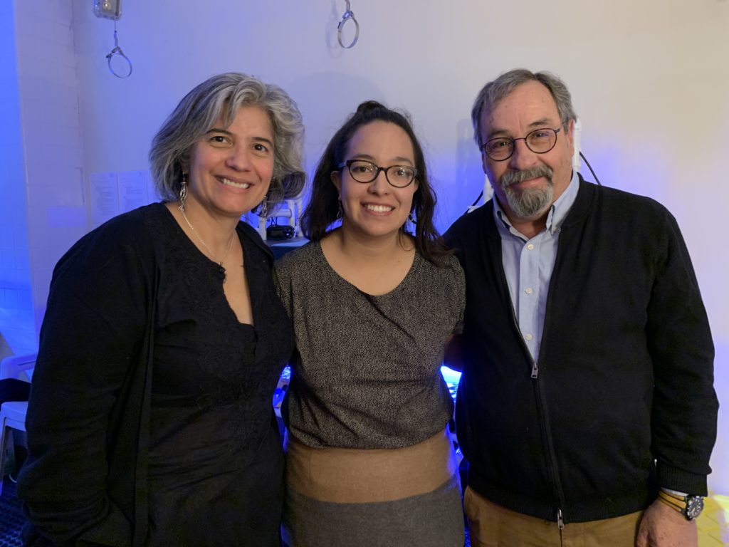 Mónica Medina, Viridiana Avila-Magaña, and Roberto Iglesias-Prieto (left to right) in their marine lab, filled with UV lamps, where they grow corals at Penn State. (Alison F. Takemura)