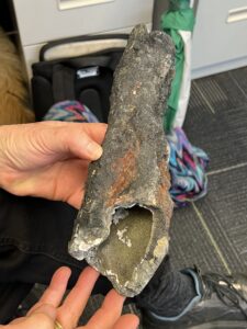 A blackish, lumpy tapered tube that is the top of a hydrothermal vent.